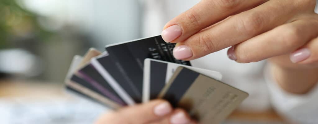 woman holding credit cards in hand close up