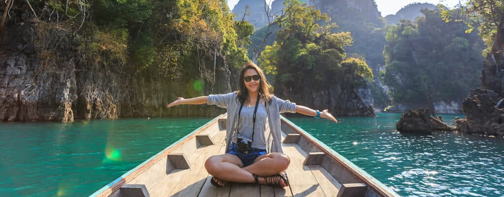 woman on boat exploring thailand