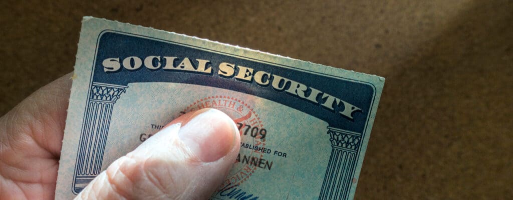 hand holding a social security card