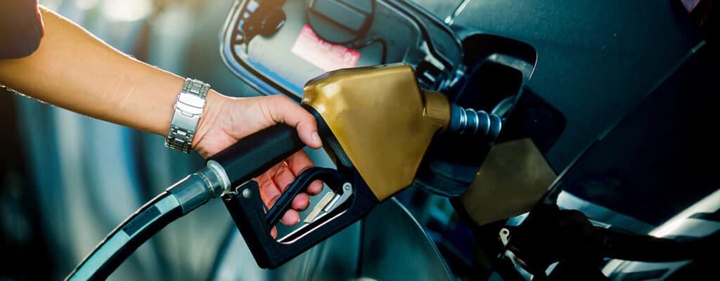 person pumping gas