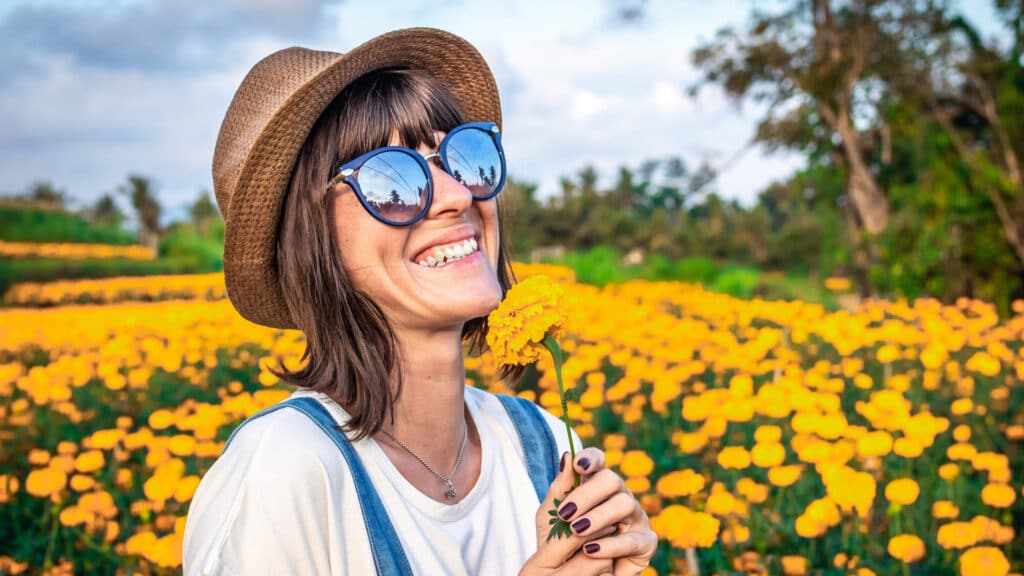 happy woman in flower field