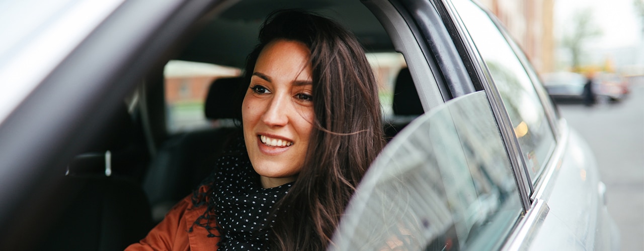 woman driving rental car