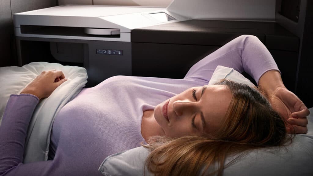 woman sleeping on Delta flight in Delta One