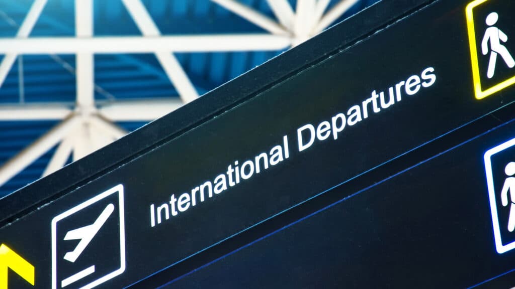 international departures sign at airport