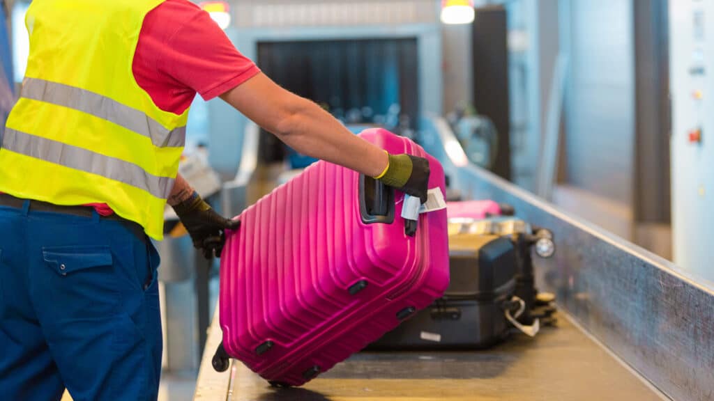 bag going on conveyor belt at airport
