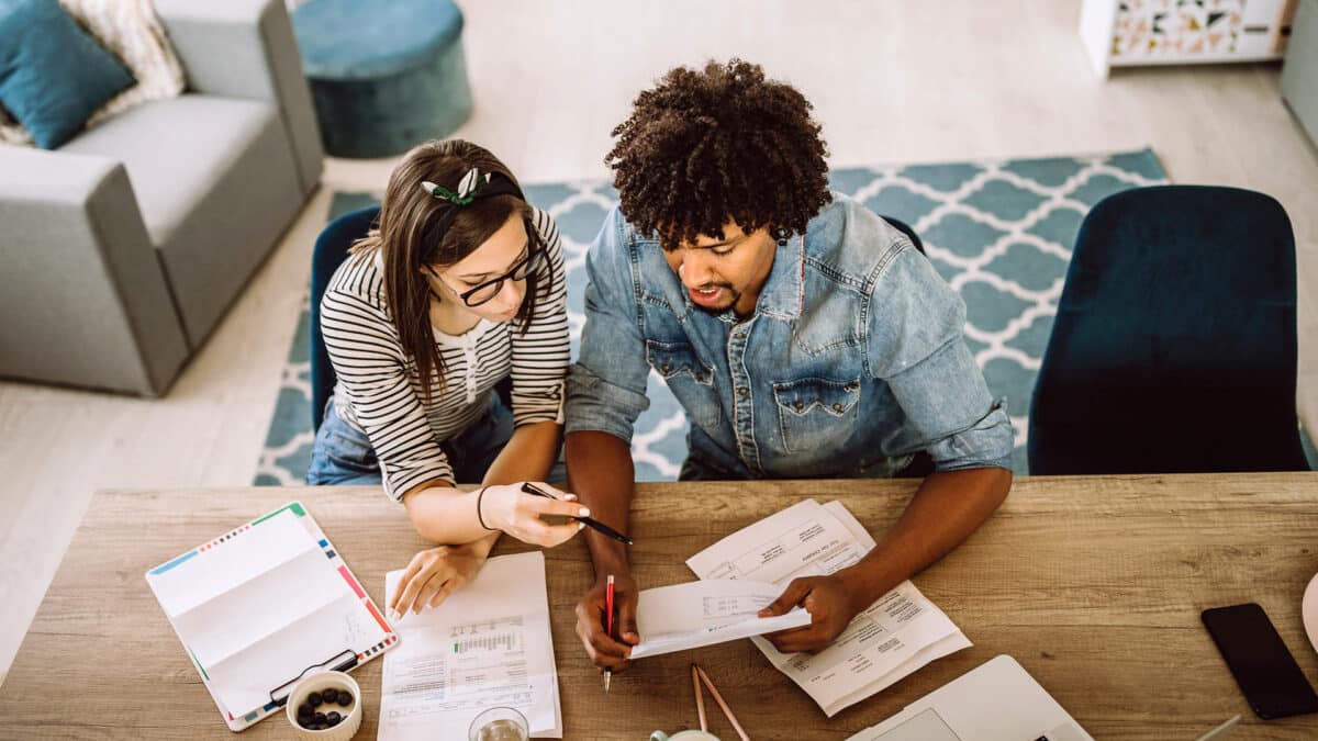 couple working on finances at home