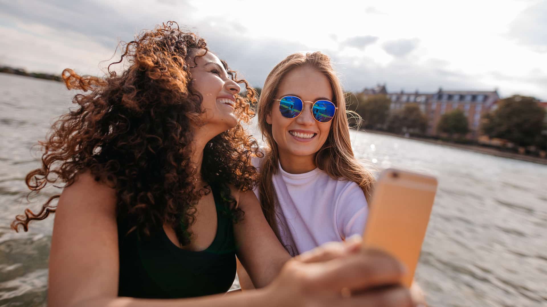 two friends taking selfie on vacation