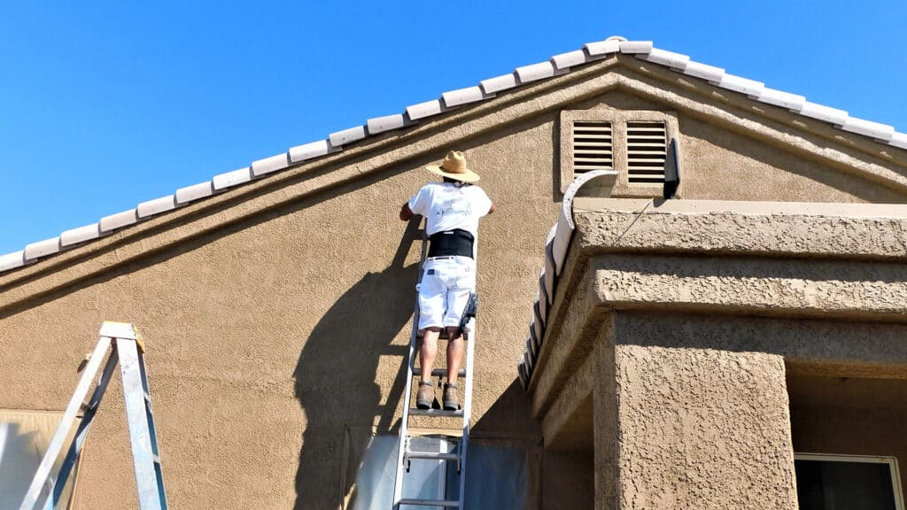 Home improvement and repair painting on a ladder