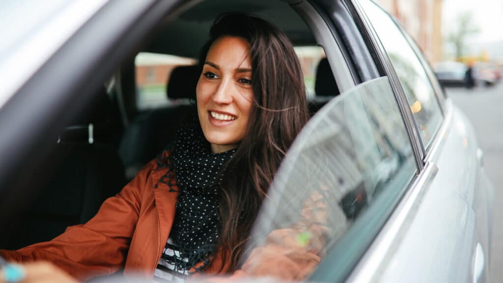 woman driving rental car