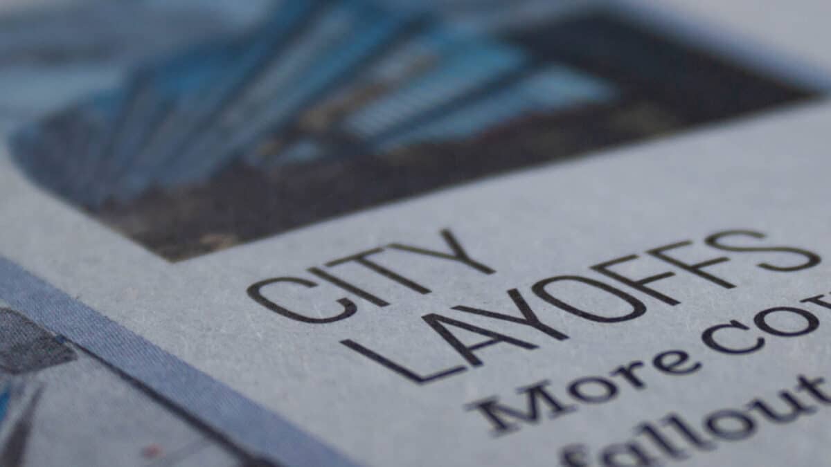 city layoffs newspaper