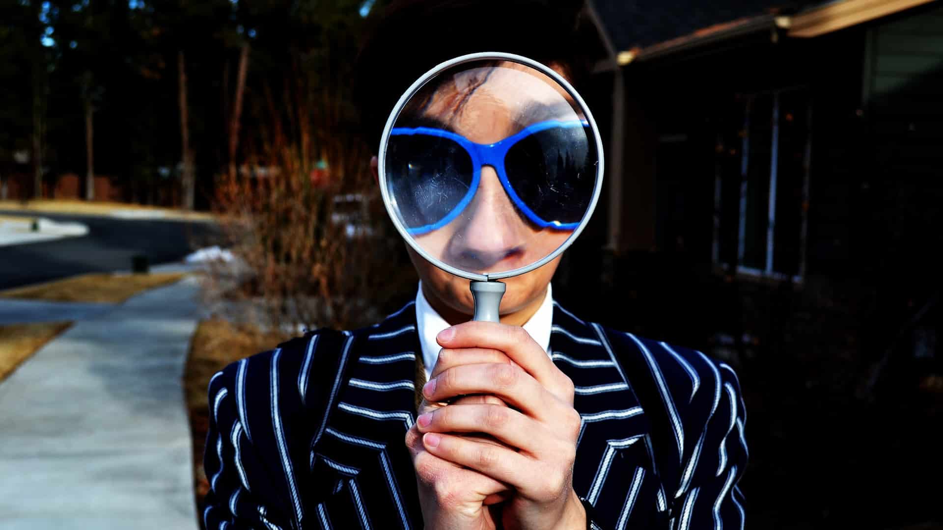 person with magnifying glass