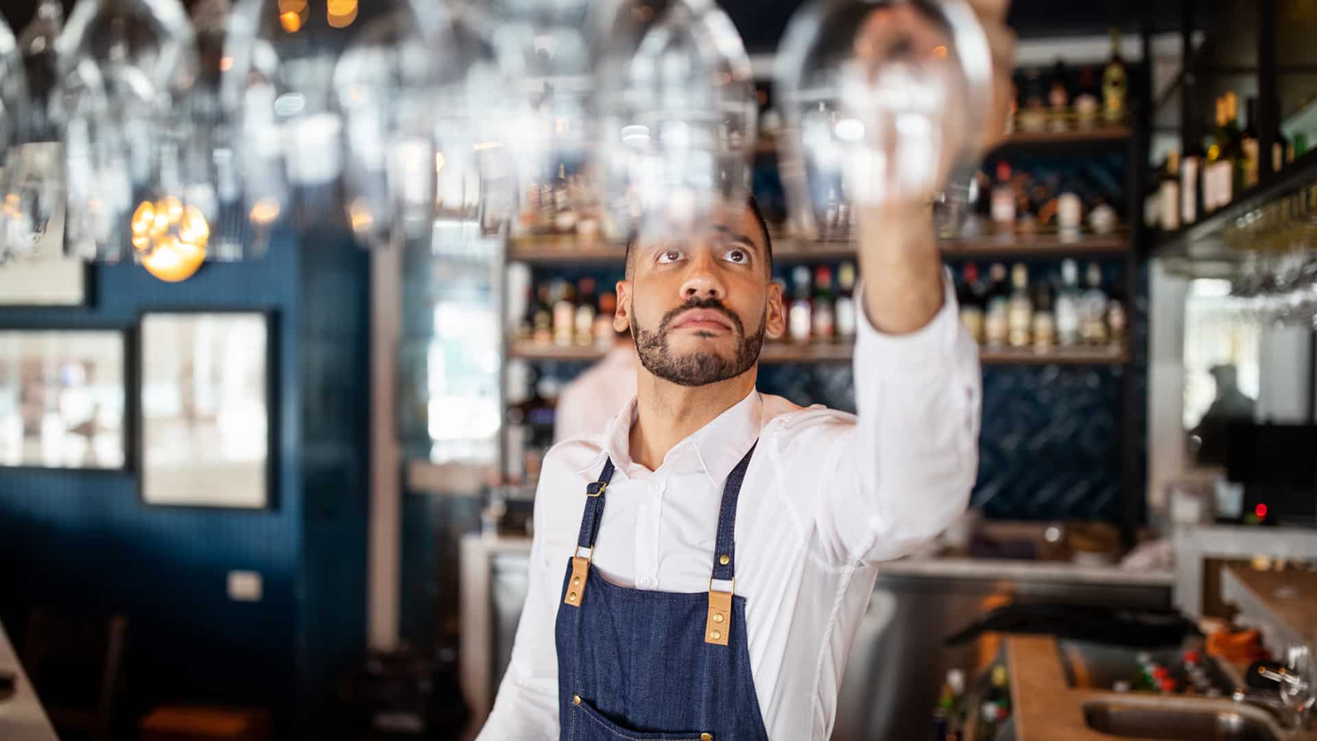 man working at a bar