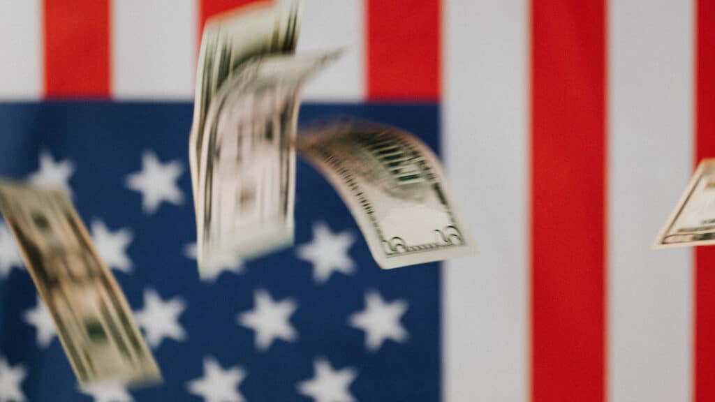 money floating over American flag
