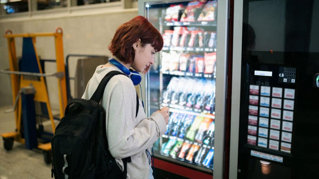 woman at vending machine
