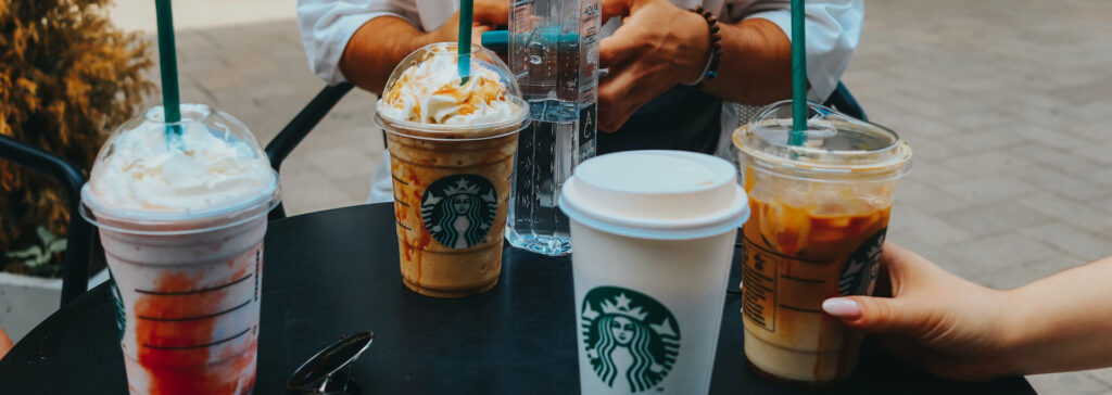 starbucks cups on an outdoor table