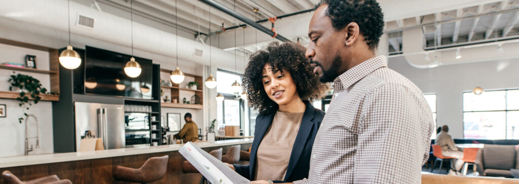 small business owners looking at documents