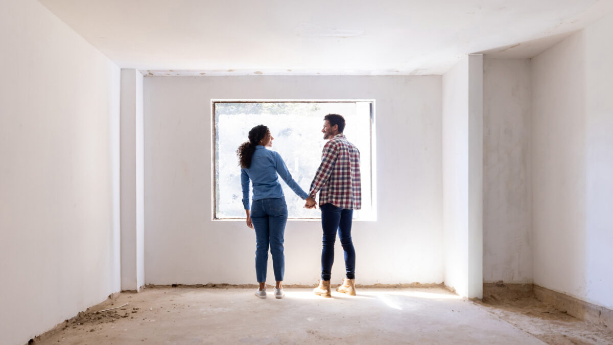 couple in living room planning renovation