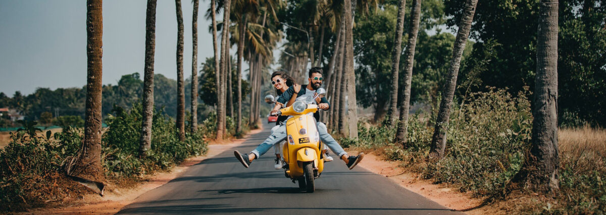 couple on motorbike while traveling