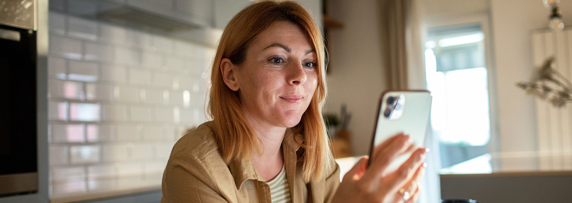 woman using phone at home