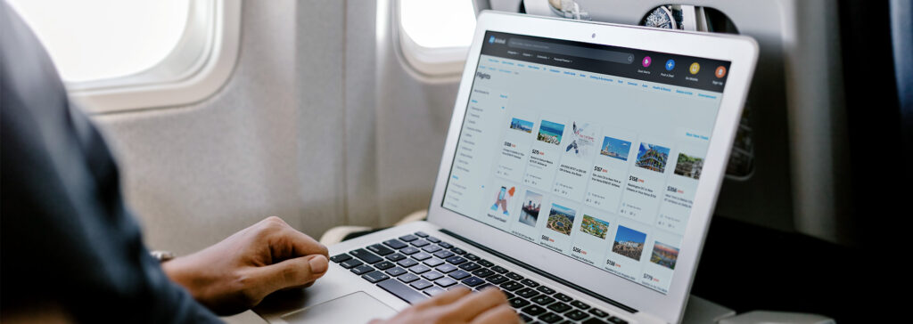Slickdeals flight search on laptop on plane