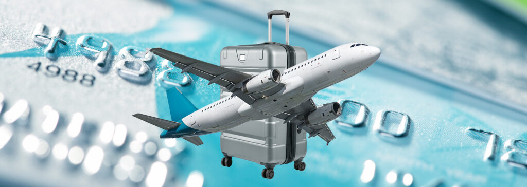 plane and suitcase over credit card