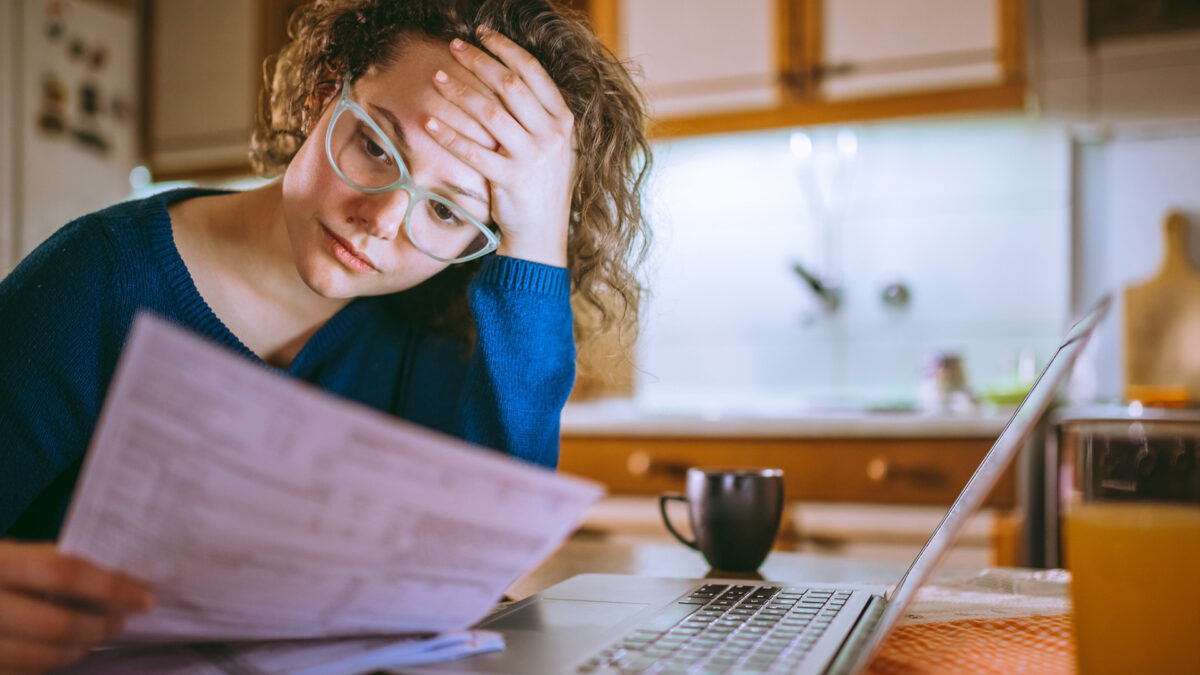 woman looking over taxes looking concerned